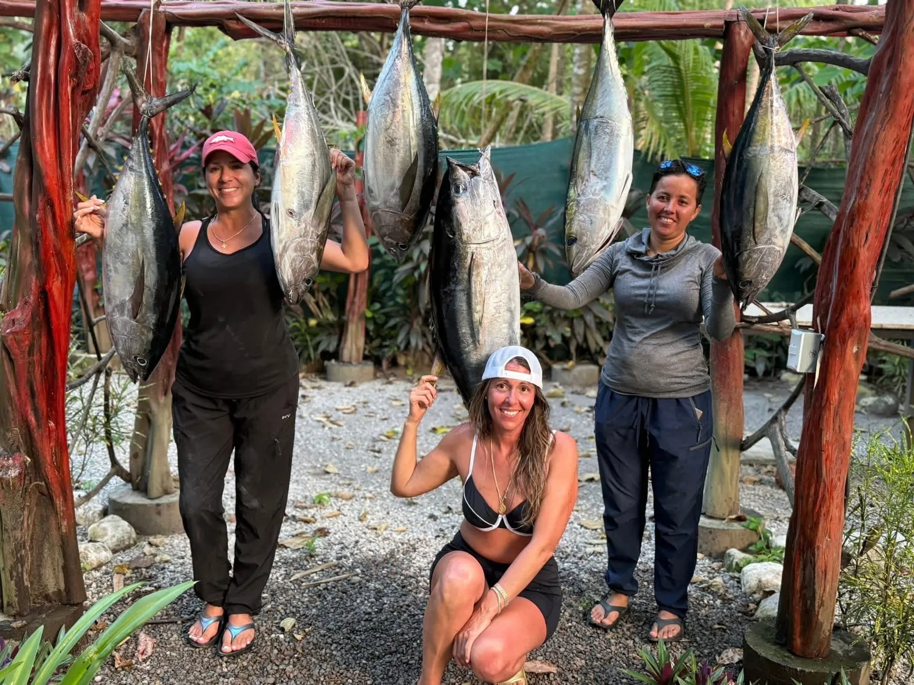 Guests with a haul of yellowfin tuna at the Sea Señorita Villa fish-cleaning station, Playa Zancudo