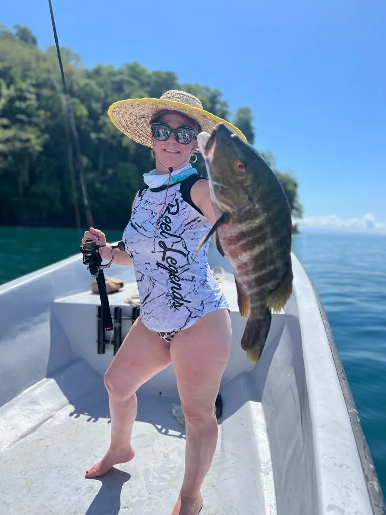 Angler holding a snapper aboard a charter on the Golfo Dulce, Playa Zancudo Costa Rica